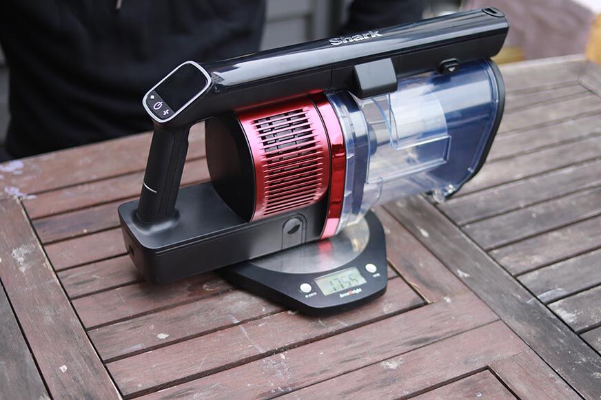 The motor unit of the Shark Anti Hair Wrap Flexology is weighed. 